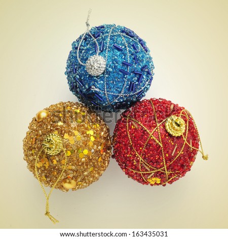 picture of some christmas balls of different colors with a retro effect