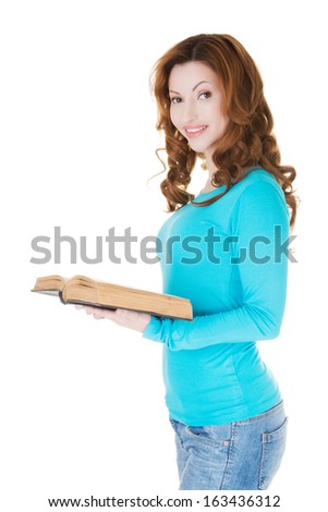 Attractive casual woman with open book.  isolated on white.