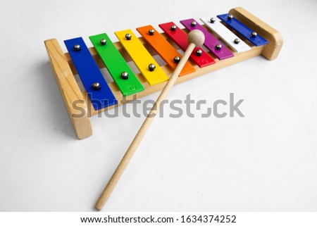 Rainbow Colored Wooden Toy Xylophone on white background