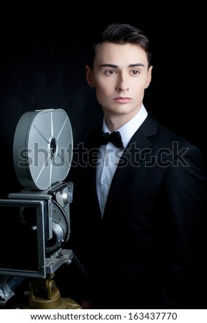 Portrait of handsome stylish man in elegant black suit 