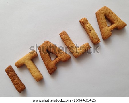 baked biscuits with shape of letters forming the word Italia
