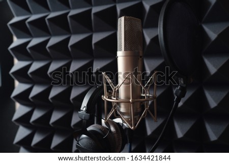 Studio microphone in recording studio with acoustic foam