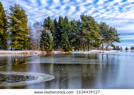 Panoramic view of a mountain lake in winter scenery in Carpathian Mountains, Slovakia (HDR photo merge)