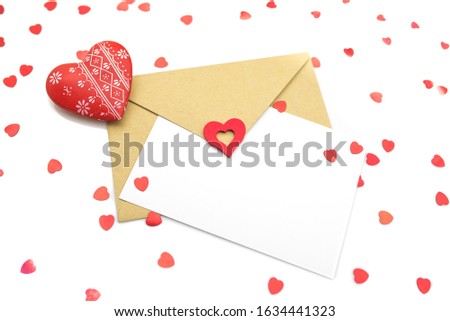 Valentines Day composition. Gift, greeting card with hearts, on white background. Close up, copy space.
