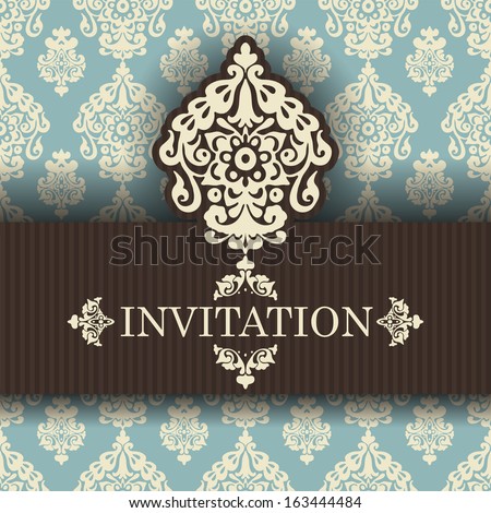 vintage invitation on damask background