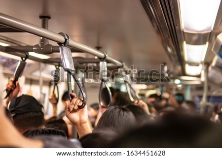 Crowd inside the train in rush hour Royalty-Free Stock Photo #1634451628