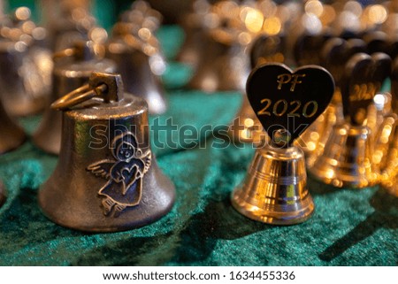 Small Christmas bells with PF 2020 on green velvet