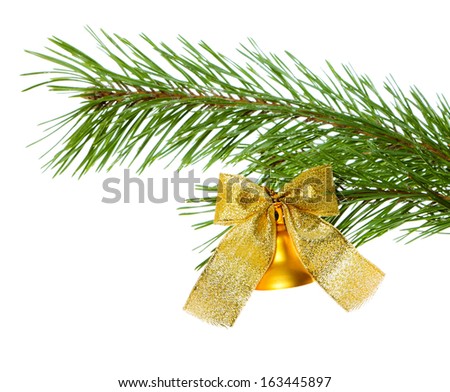 Christmas bell with bow on pine branch isolated on white background
