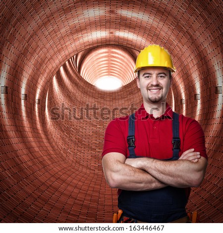 handyman in a brick tunnel