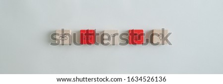 Wide view image of five wooden blocks with contact and information icons placed over grey background.