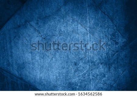 Trendy Classic Blue color. Stone texture for designers. Wall abstraction. Color of the year 2020. Paint spots. Rock surface with cracks. Abstract texture. Rock texture. Stone Background Royalty-Free Stock Photo #1634562586