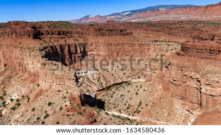 Capitol Reef, Utah, USA. Surrounds a long wrinkle in the earth known as the Waterpocket Fold, with layers of golden sandstone, canyons and striking rock formations.