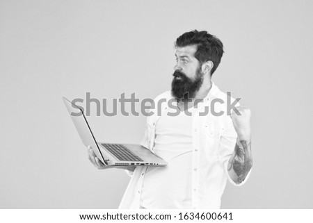 Successful developer, Online shopping, Programmer with laptop. Surfing internet Online payment. Online purchase. Man using notebook Digital world Programming concept Bearded man with notebook