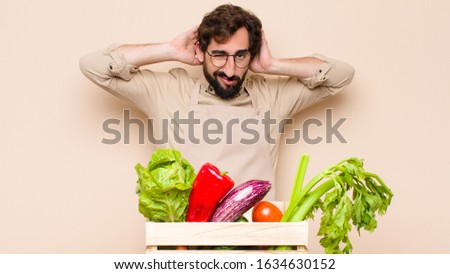 green grocery man feeling frustrated and annoyed, sick and tired of failure, fed-up with dull, boring tasks