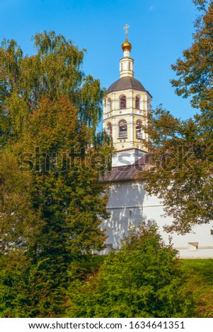 Exterior view of St. Paphnutius Borovsky Monastery from river Isterma. Bell Tower in the background. Kaluga Region. Russia