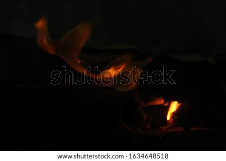 a large flame burns paper