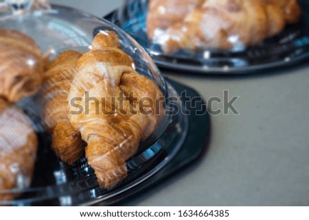 Fresh and delicious croissants on table, stock photo