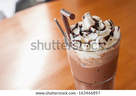 Iced cocoa and whipped cream topped with chocolate Royalty-Free Stock Photo #163466897