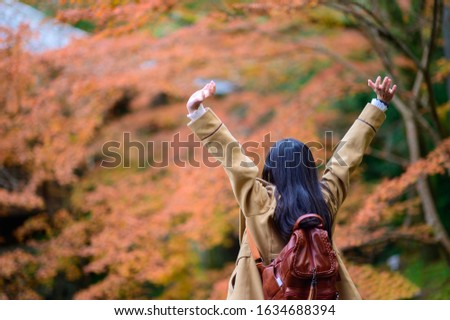Woman traveller tourist enjoy and cheerfully to see the scenery view of autumn village in Japan countryside, Autumn season change blooming on popular and famous place for tourist visit Japan 