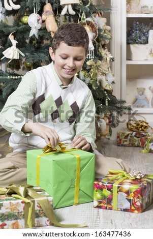 Boy opens Christmas gift