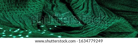 The texture of the background picture the color of the fabric under water, green-blue corrugated fabric, fabric with parallel or diagonal folds with serrated folds; products from such a fabric.