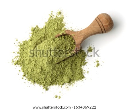 Wooden scoop of henna powder isolated on white