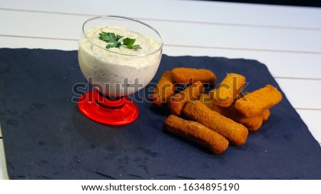 Tartar sauce in bowl with nuggets stock photo 