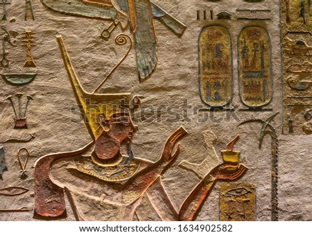 Ancient egypt carving color image on wall of temple in Egypt