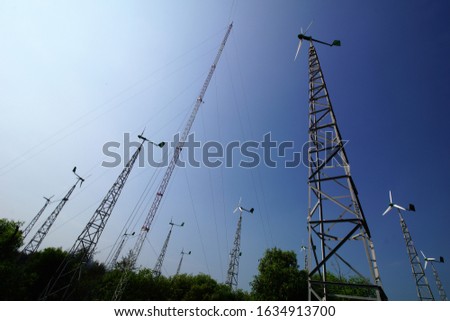Wind power plant on the coast of Samas, Yogyakarta, Indonesia. Royalty-Free Stock Photo #1634913700