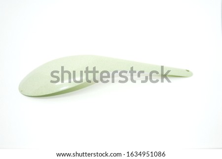 Green Spoon on White background 