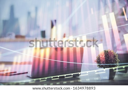 Forex Chart hologram on table with computer background. Multi exposure. Concept of financial markets.