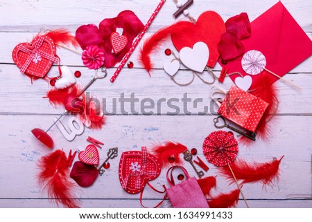 Full framed vintage wooden white background with red hearts and gifts. The concept of Valentine Day top view empty copy space for text.