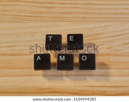 Keyboard keys creating words of love on pine wood and embossed shadow