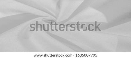 Texture, background, pattern, silk fabric of white color, solid light white silk satin fabric of the duchess Really beautiful silk fabric with satin sheen. Perfect for your design, wedding invitations