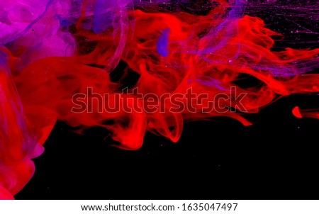 Colored space background. Red and purple watercolor ink in water on a black background. Cool trending screensaver. Neural networks.