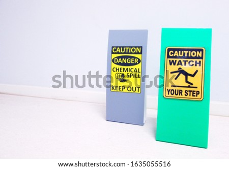 The Chemical Spill kit tag stand and warning danger caution hazard tag sign watch your step for emergency response situation when the chemical spill out, safety first in laboratory workplace concepts.