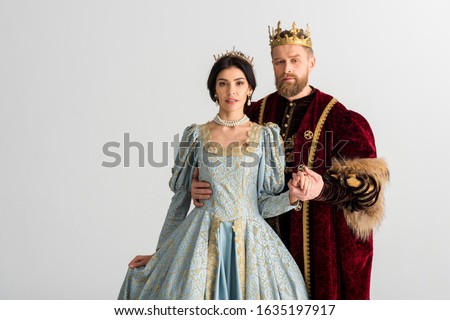 handsome king hugging queen with crown isolated on grey