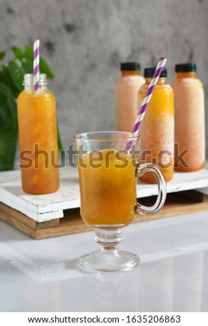 jamu is traditional medicine and herbal drink in indonesia.made from natural materials,such as parts of plants such as root,leaf,flower and etc.this picture is a jamu based on turmeric and tamarind