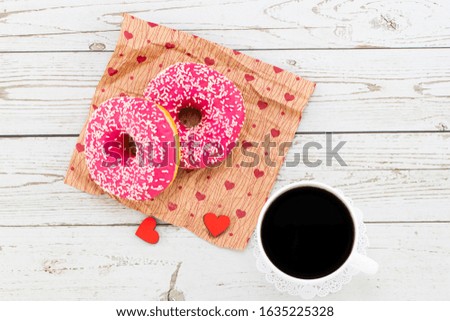 Valentine's day romantic breakfast. Gift, hearts and donuts. Valentines day concept. Copy space.