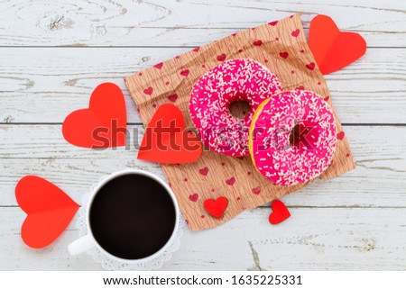 Valentine's day romantic breakfast. Gift, hearts and donuts. Valentines day concept. Copy space.