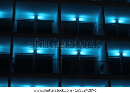 neon lights on building balconies