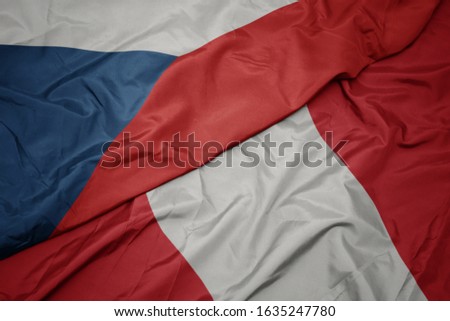 waving colorful flag of peru and national flag of czech republic. macro