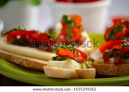 Bruschetta with tomato, basil, cheese and olive oil