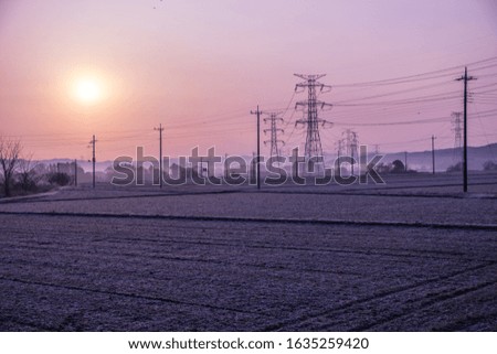 View of frosty fields and sunrise.