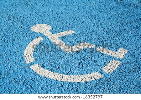 Blue handicap parking or wheelchair accessible sign in parking