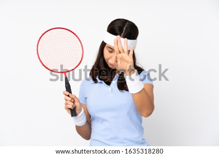 Young badminton player woman over isolated white background counting eight with fingers