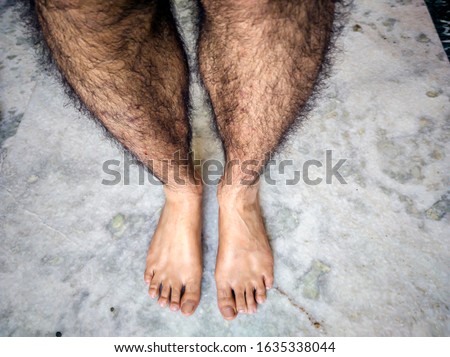 fair skin feet with hairy legs