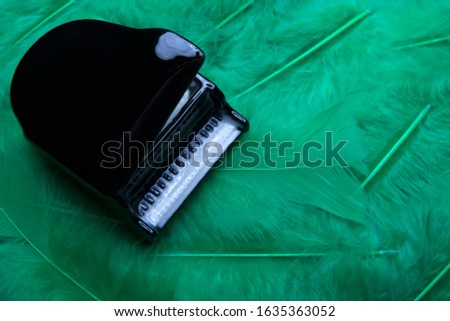 black piano bird feather background