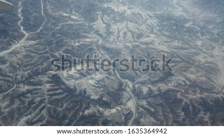 Aerial shot of hills taken above in a plane.
