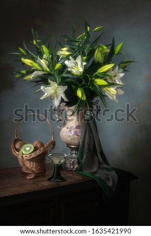 Still life with bouquet of white lily  and kiwi